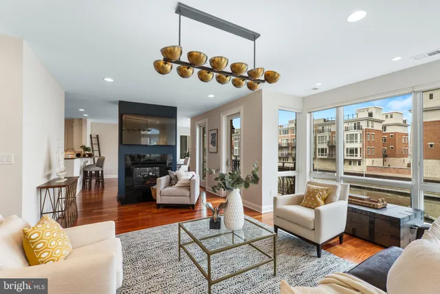 a kitchen with granite countertop a sink a counter space appliances and cabinets