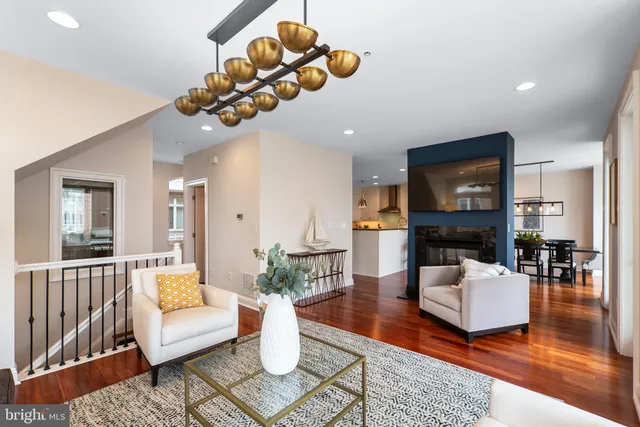 a kitchen with stainless steel appliances granite countertop a stove refrigerator and cabinets