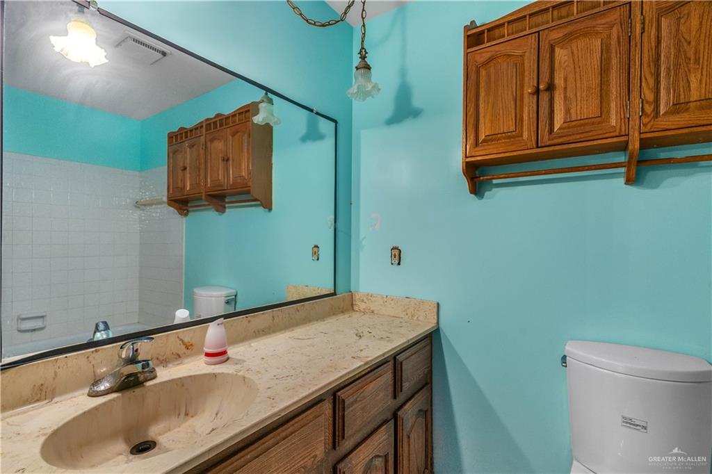 7654 East Alberta Road Edinburg, TX 78542 - Photo 14 of 33 a bathroom with a sink and a mirror