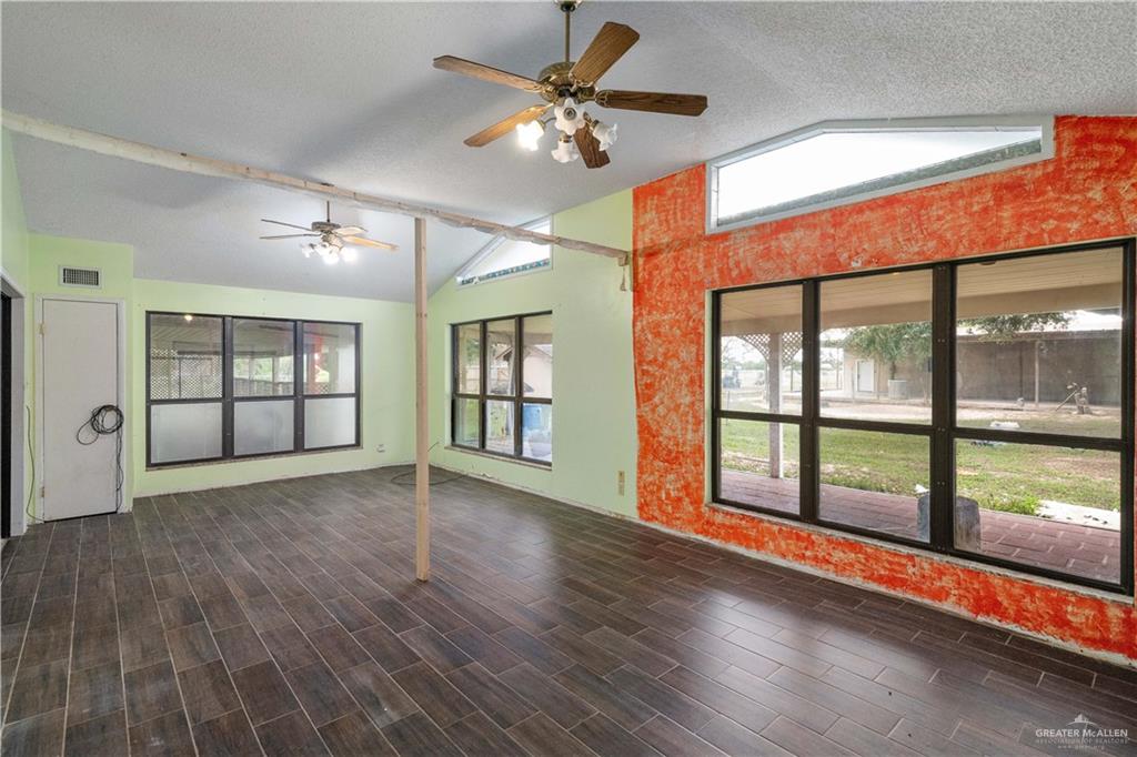7654 East Alberta Road Edinburg, TX 78542 - Photo 15 of 33 wooden floor in an empty room with a window