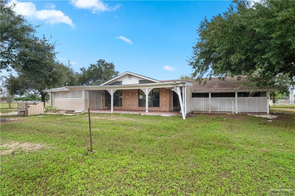 7654 East Alberta Road Edinburg, TX 78542 - Photo 16 of 33 a front view of a house with garden