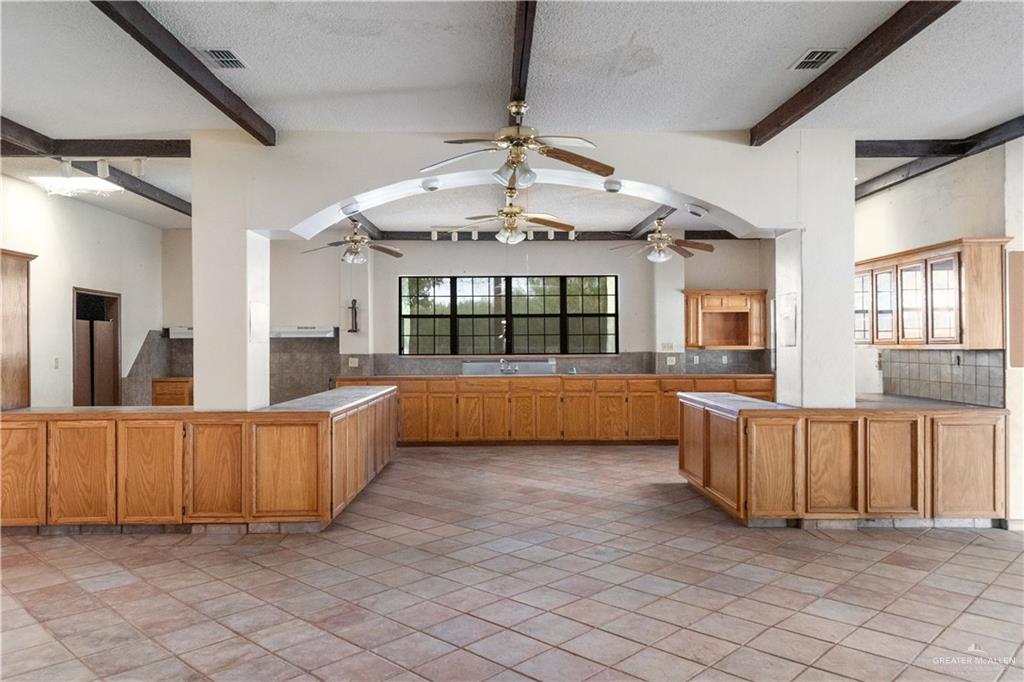 7654 East Alberta Road Edinburg, TX 78542 - Photo 21 of 33 a view of a kitchen with furniture and a large window