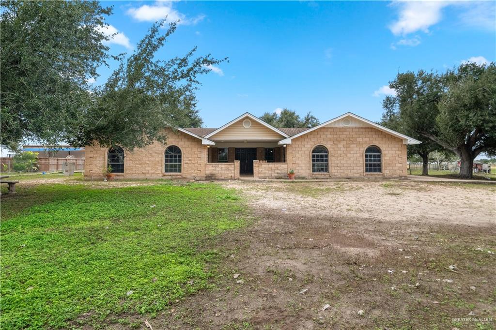 7654 East Alberta Road Edinburg, TX 78542 - Photo 27 of 33 a house with green field in front of it