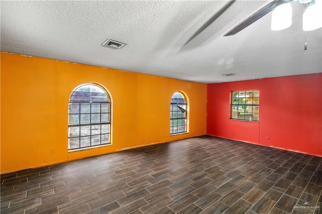 7654 East Alberta Road Edinburg, TX 78542 - Photo 31 of 33 an empty room with windows