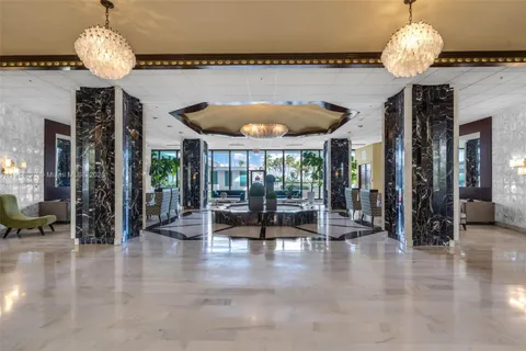 a view of a dining room with furniture wooden floor and chandelier
