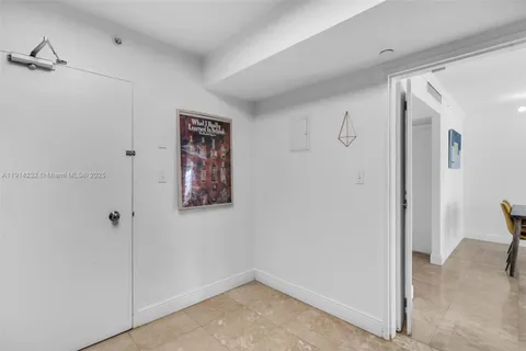 a view of a hallway with closet area