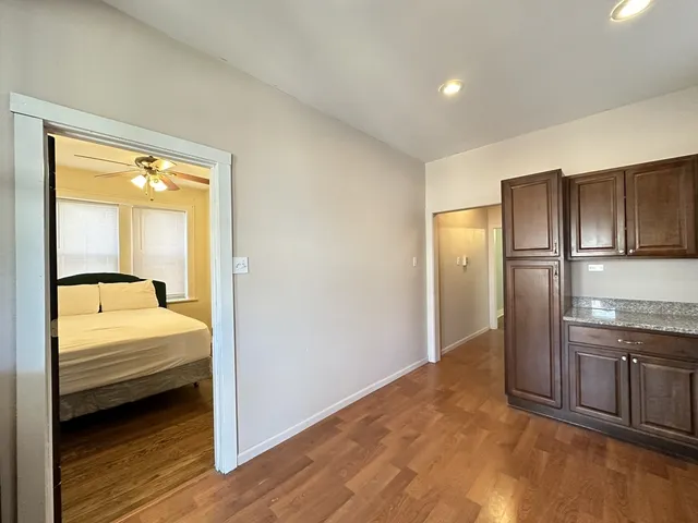 a bathroom with a bathtub and a walk in closet