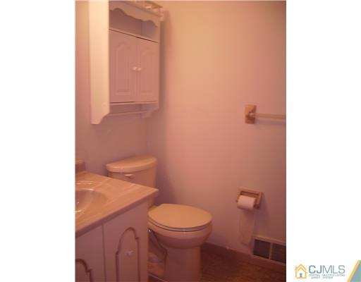 39 Roxy Avenue Edison, NJ 08820 - Photo 11 of 20 a white toilet sitting next to a white sink