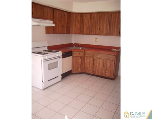 39 Roxy Avenue Edison, NJ 08820 - Photo 6 of 20 a kitchen with a sink cabinets and appliances