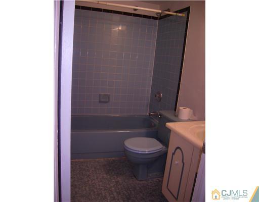 39 Roxy Avenue Edison, NJ 08820 - Photo 8 of 20 a bathroom with a granite countertop toilet and sink