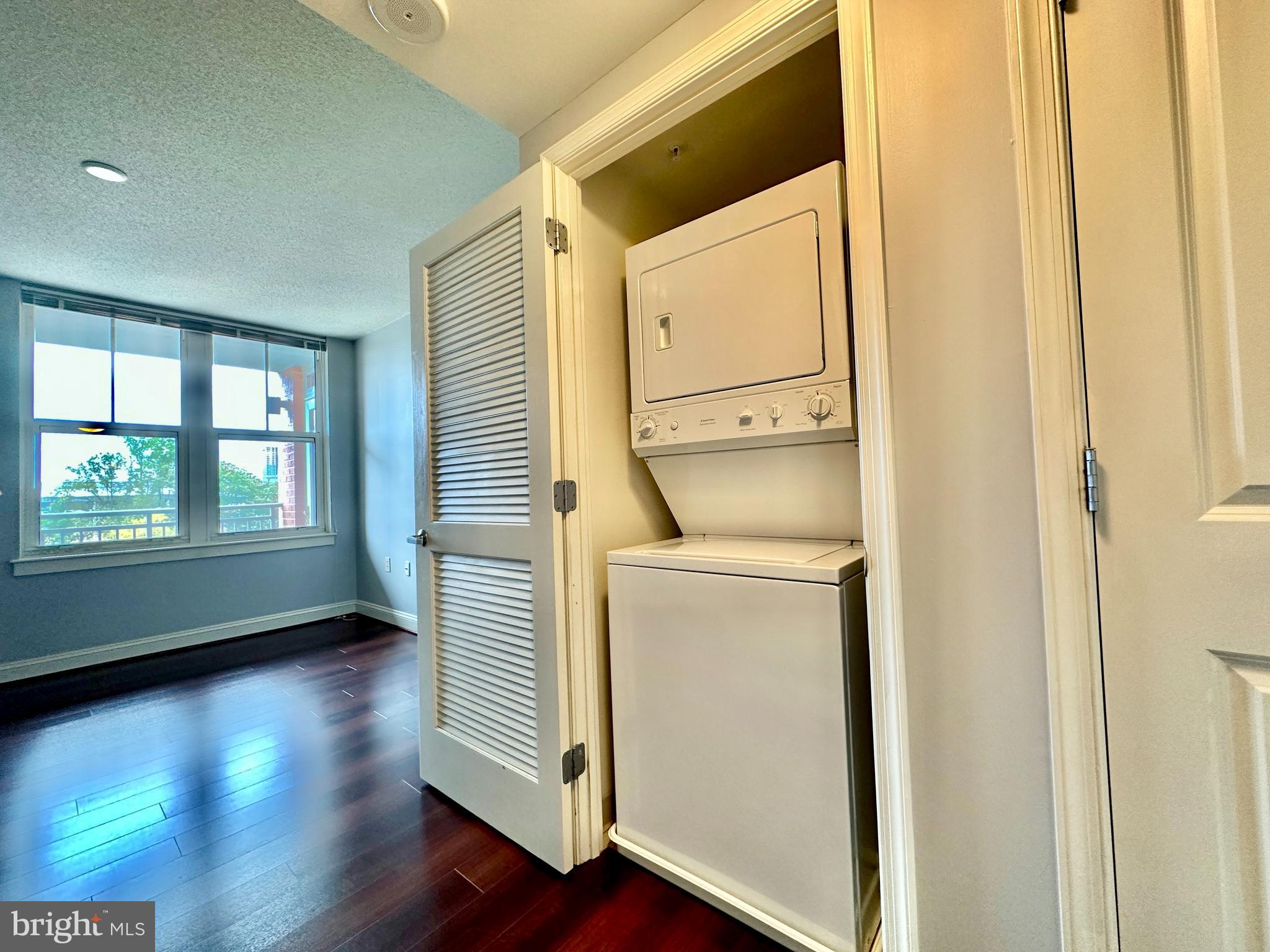 11760 Sunrise Valley Drive, Unit 512 Reston, VA 20191 - Photo 11 of 19 a utility room with dryer and washer