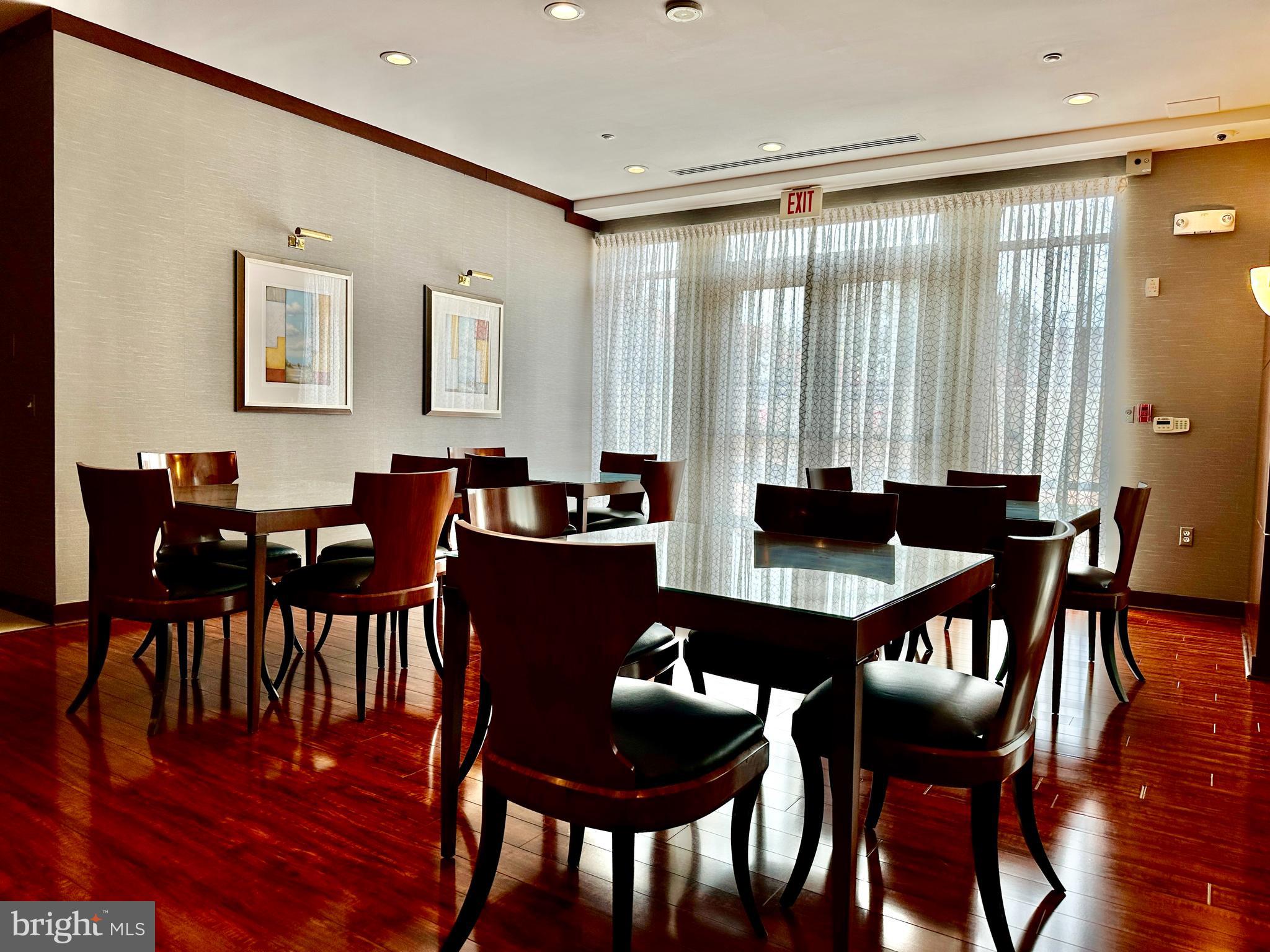 11760 Sunrise Valley Drive, Unit 512 Reston, VA 20191 - Photo 12 of 19 a dining room with furniture and wooden floor