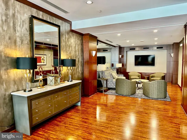 a living room with fireplace furniture and a flat screen tv