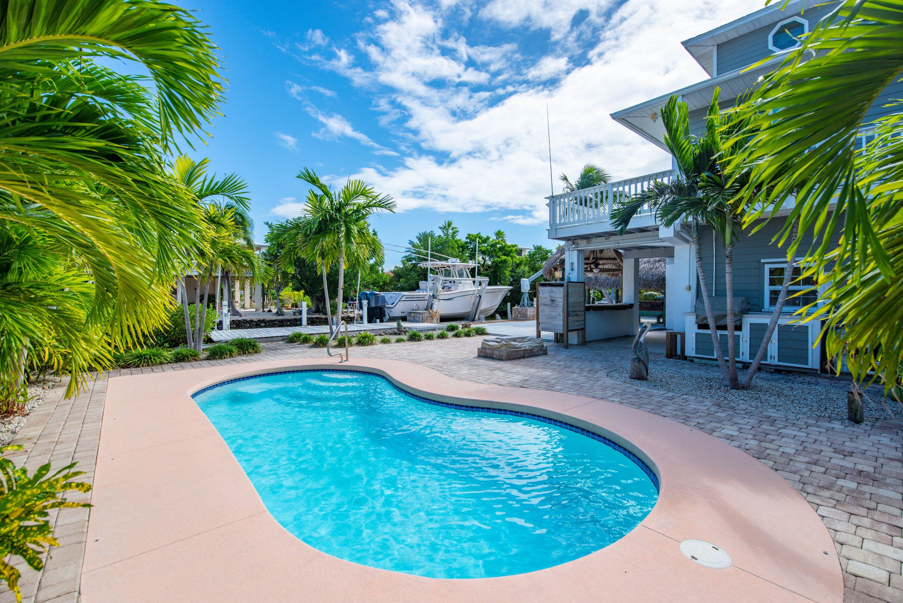 a view of a swimming pool with a patio