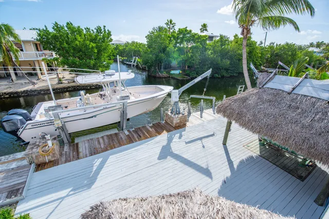 a view of a backyard with sitting area