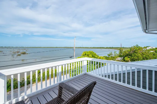 a view of balcony with wooden floor