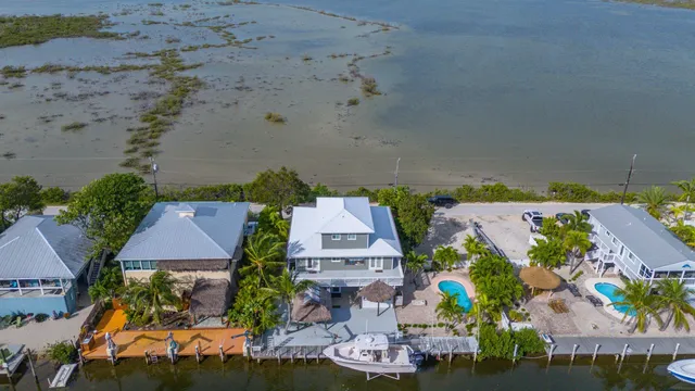 an aerial view of a house with a swimming pool