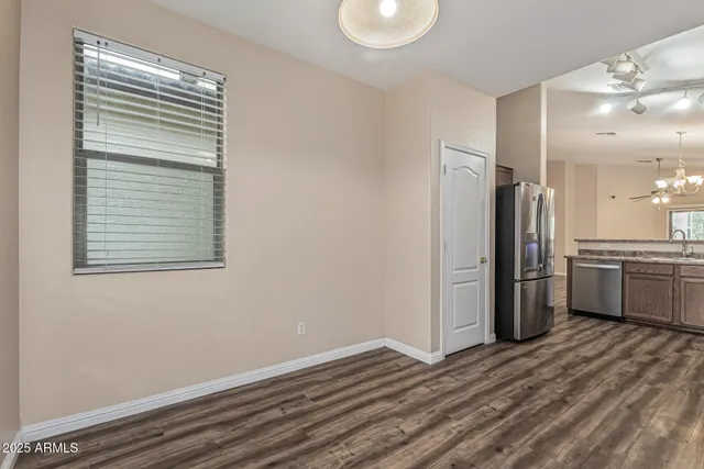 a view of a kitchen with a stove cabinets and a wooden floor