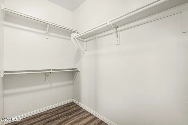 a view of an empty walk in closet