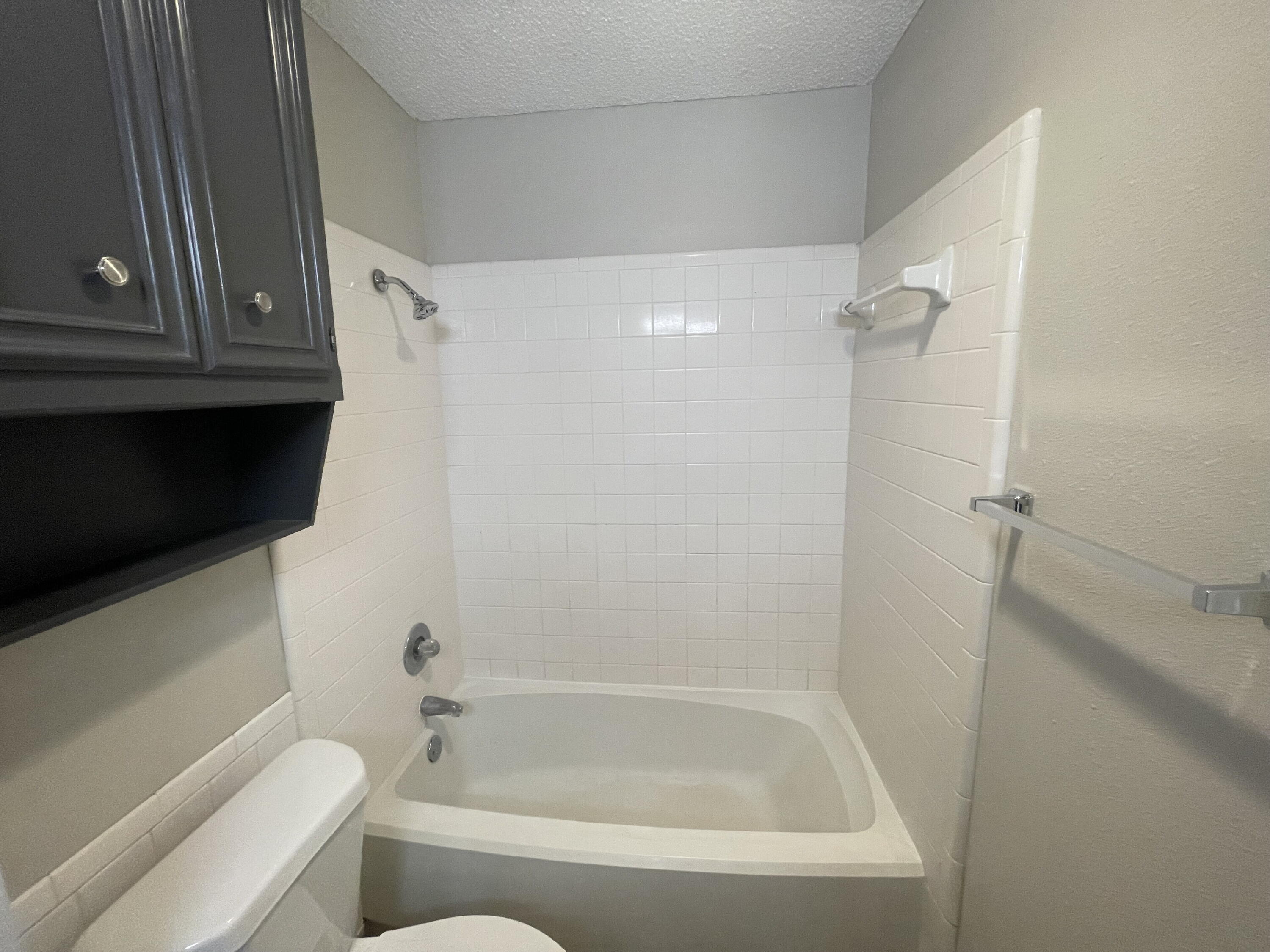 6724 4th Street, Unit A Lubbock, TX 79416 - Photo 9 of 9 a bathroom with a bathtub