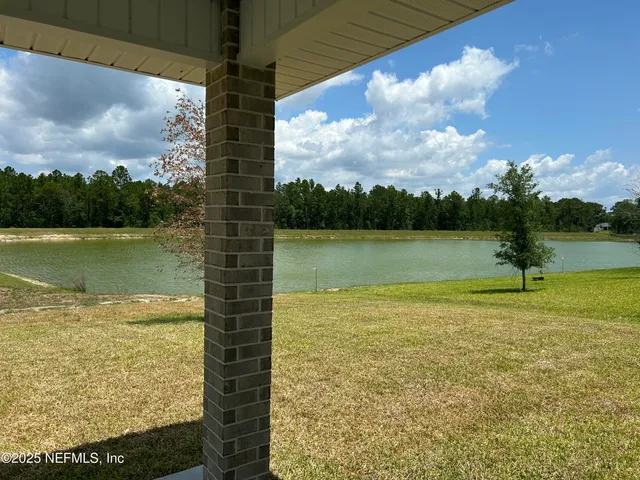 a view of a lake and a yard