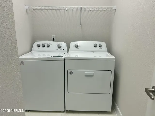 a utility room with dryer and washer