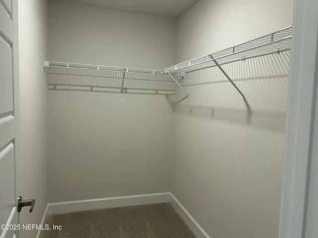 a view of a room with racks on the wall