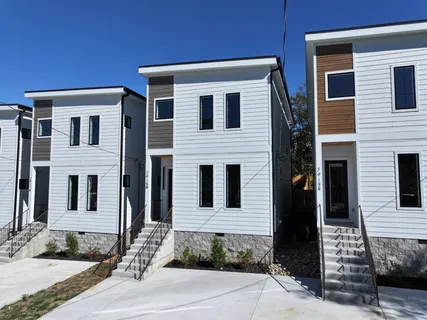 a front view of a house with stairs