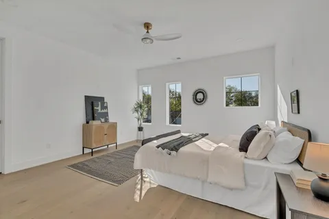 a bathroom with a sink vanity granite and a mirror