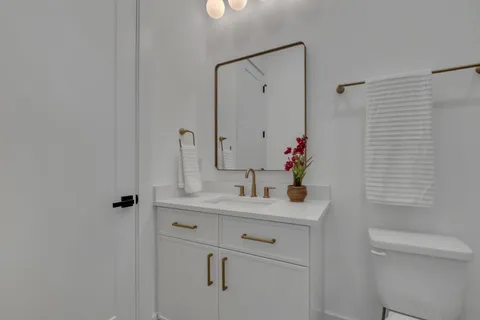 a bedroom with a bed and a lamp