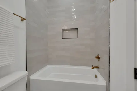 a bathroom with a sink vanity granite and a mirror
