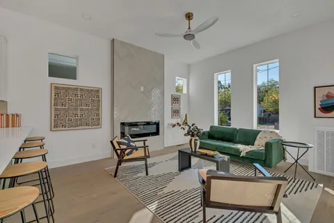 a kitchen with a sink and chandelier