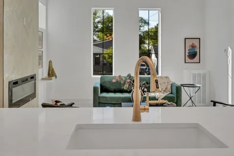 a kitchen with stainless steel appliances white cabinets and a stove