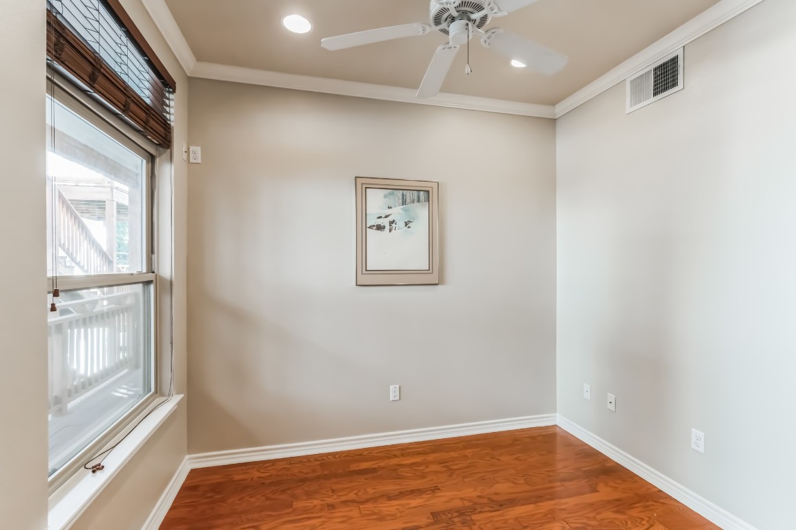 305 East 31st Street, Unit 6 Austin, TX 78705 - Photo 18 of 26 a view of room with window and wooden floor
