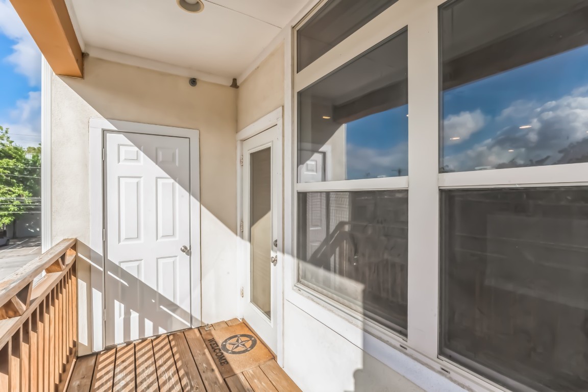305 East 31st Street, Unit 6 Austin, TX 78705 - Photo 2 of 26 a view of staircase with wooden floor and white walls
