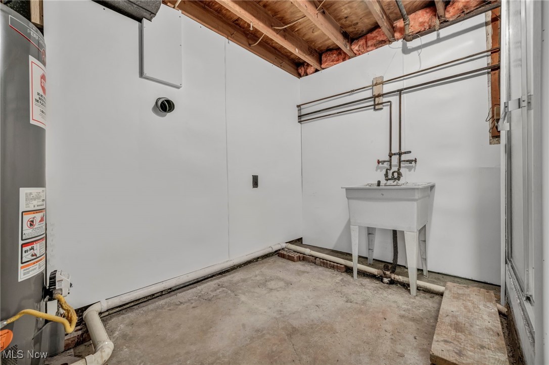 2514 Primewood Road Akron, OH 44305 - Photo 35 of 49 Below grade area with gas water heater and a sink