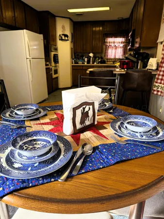 a kitchen with a refrigerator and a stove