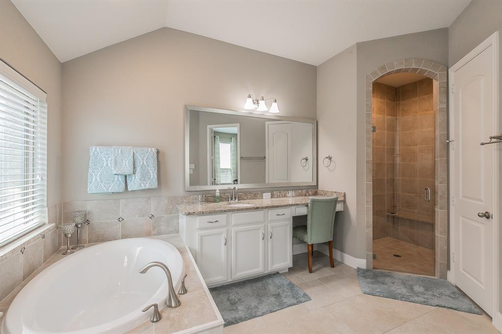 14804 Cedar Flat Way Fort Worth, TX 76262 - Photo 16 of 35 a bathroom with a tub sink and mirror