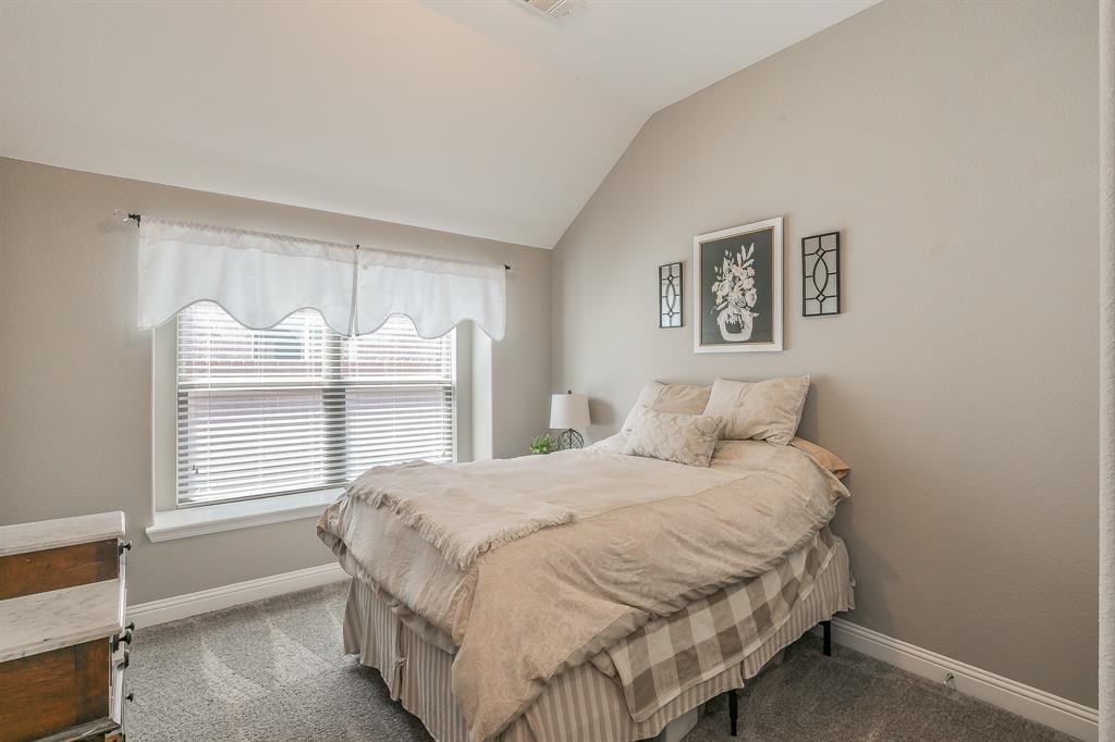 14804 Cedar Flat Way Fort Worth, TX 76262 - Photo 19 of 35 a bedroom with a bed and a window