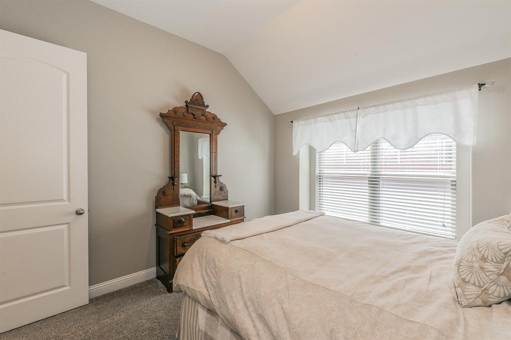14804 Cedar Flat Way Fort Worth, TX 76262 - Photo 20 of 35 a bedroom with a bed and a window