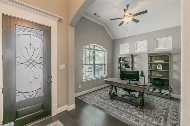 a living room with furniture a rug and a window