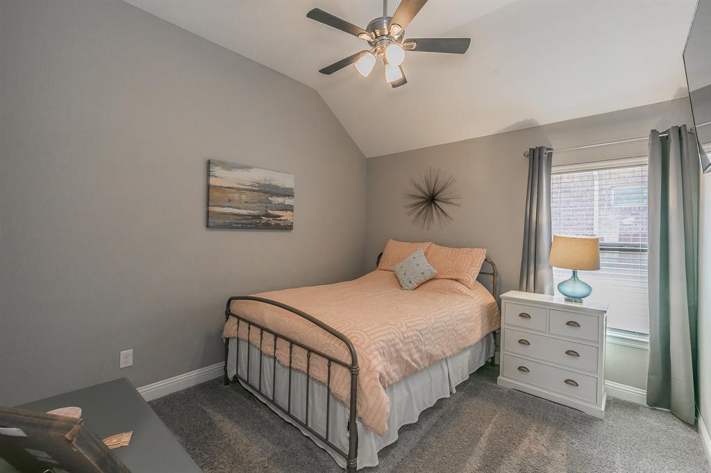 14804 Cedar Flat Way Fort Worth, TX 76262 - Photo 22 of 35 a bedroom with a bed a lamp and fan