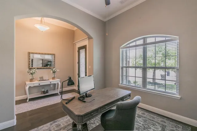 a workspace with furniture and a window