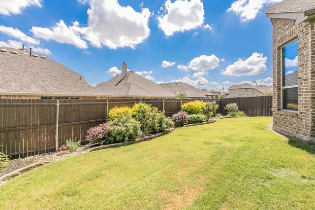 a view of a garden with a small pool