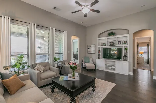 a living room with furniture or couch and a flat screen tv