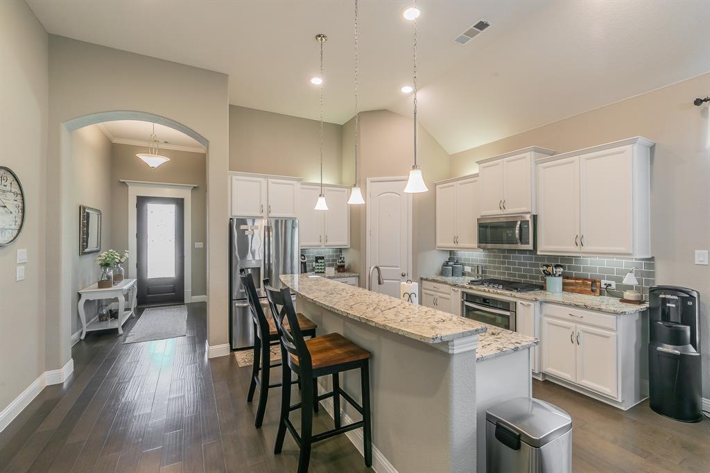 14804 Cedar Flat Way Fort Worth, TX 76262 - Photo 8 of 35 a large kitchen with a table and chairs
