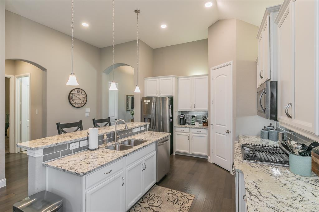 14804 Cedar Flat Way Fort Worth, TX 76262 - Photo 9 of 35 a large bathroom with a granite countertop double vanity sink a large mirror and a shower
