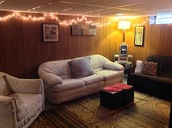 61 Tioga Street Springfield, MA 01128 - Photo 17 of 20 a living room with furniture and a rug