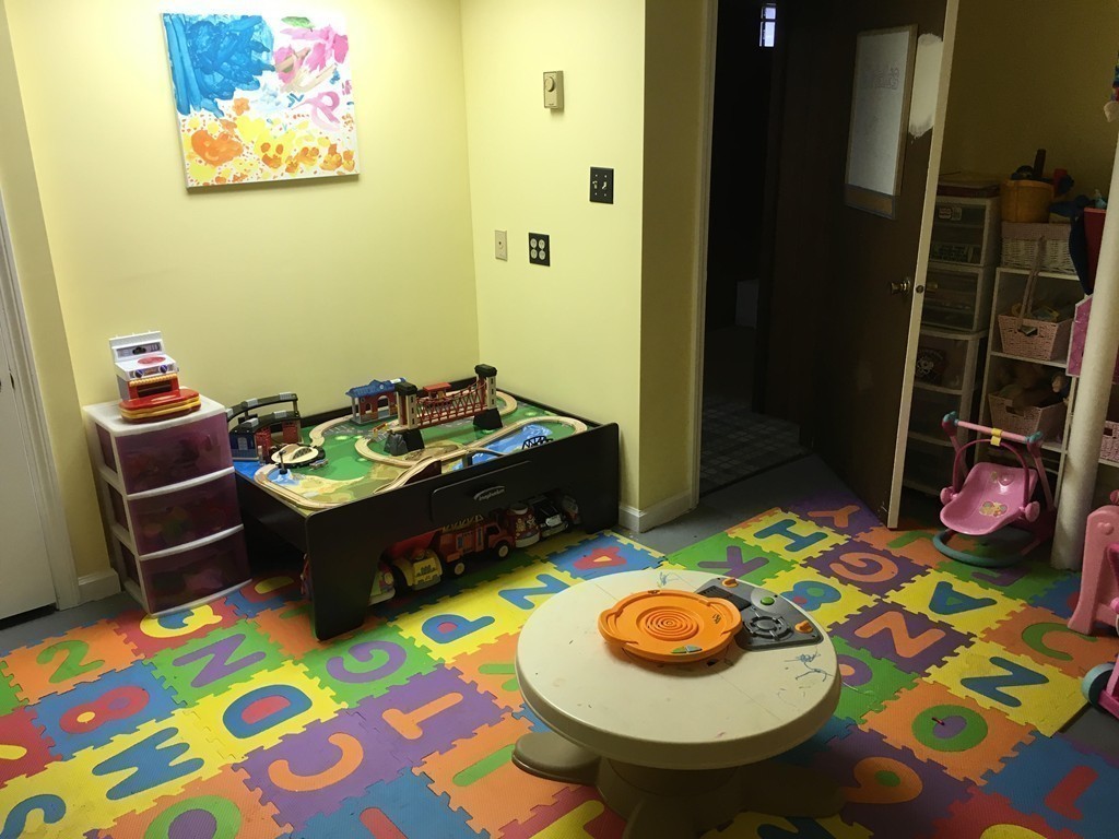 61 Tioga Street Springfield, MA 01128 - Photo 18 of 20 a room with furniture and rug