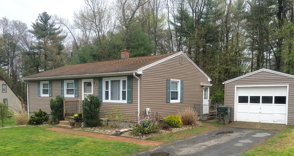 61 Tioga Street Springfield, MA 01128 - Photo 2 of 20 a view of a house with a yard